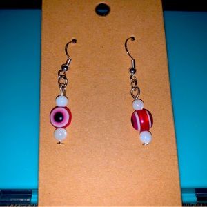 Pink evil eye dangle earrings